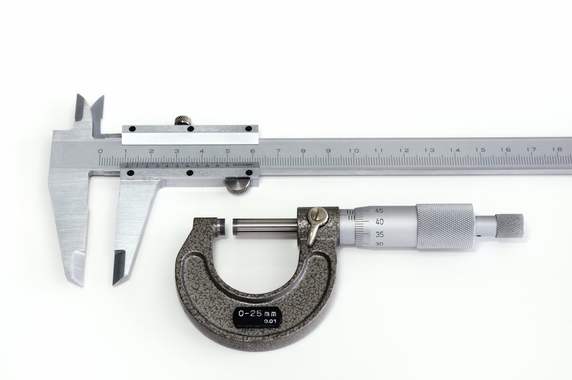 Precision measurement with calipers on industrial component